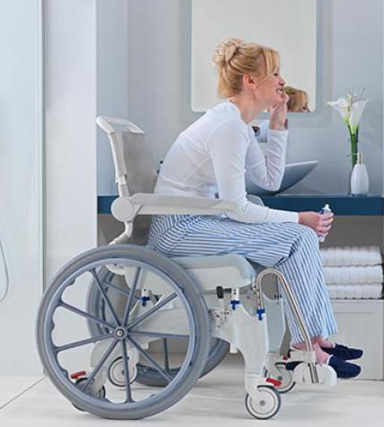 Self propelled shower commode chair in bathroom