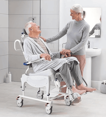 Attendant propelled shower commode chair in bathroom